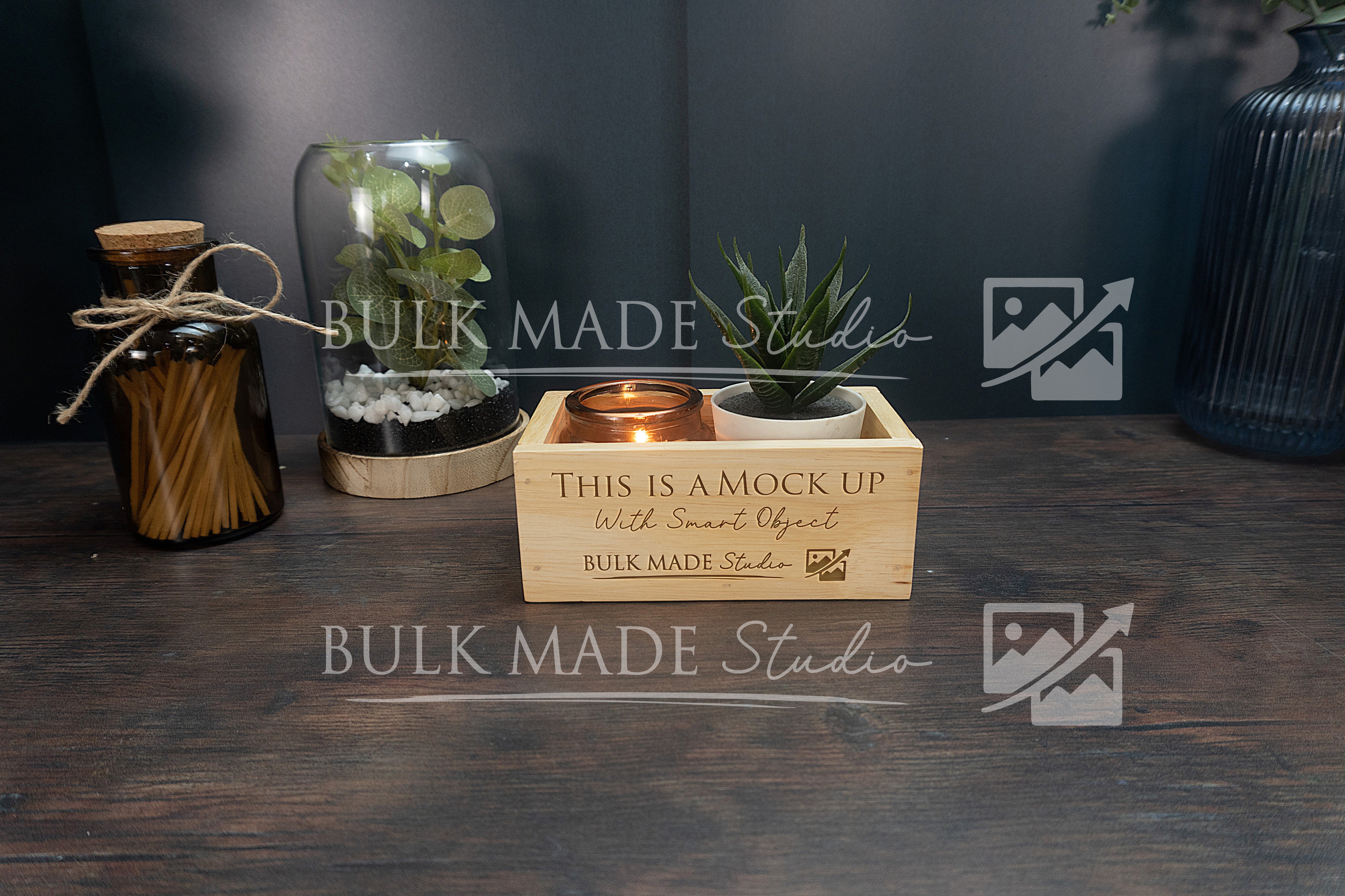 Wooden crate with decorative items on a dark surface, featuring 'Bulk Made Studio' branding.