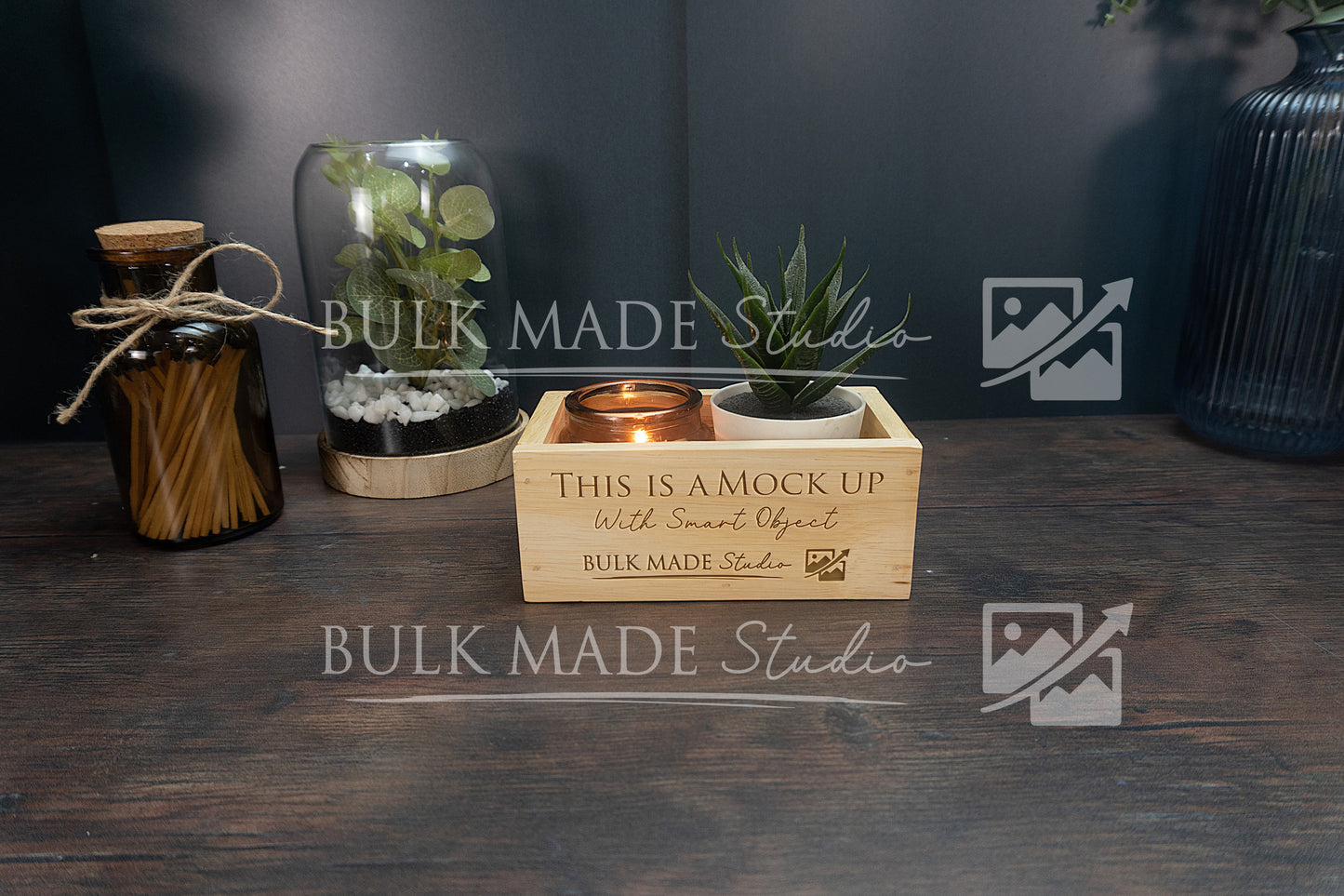 Wooden crate with decorative items on a dark surface, featuring 'Bulk Made Studio' branding.