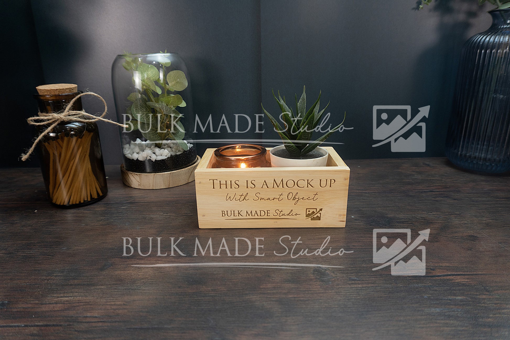Wooden crate with decorative items on a dark surface, featuring 'Bulk Made Studio' branding.