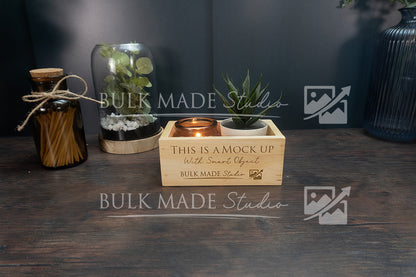 Wooden crate with decorative items on a dark surface, featuring 'Bulk Made Studio' branding.