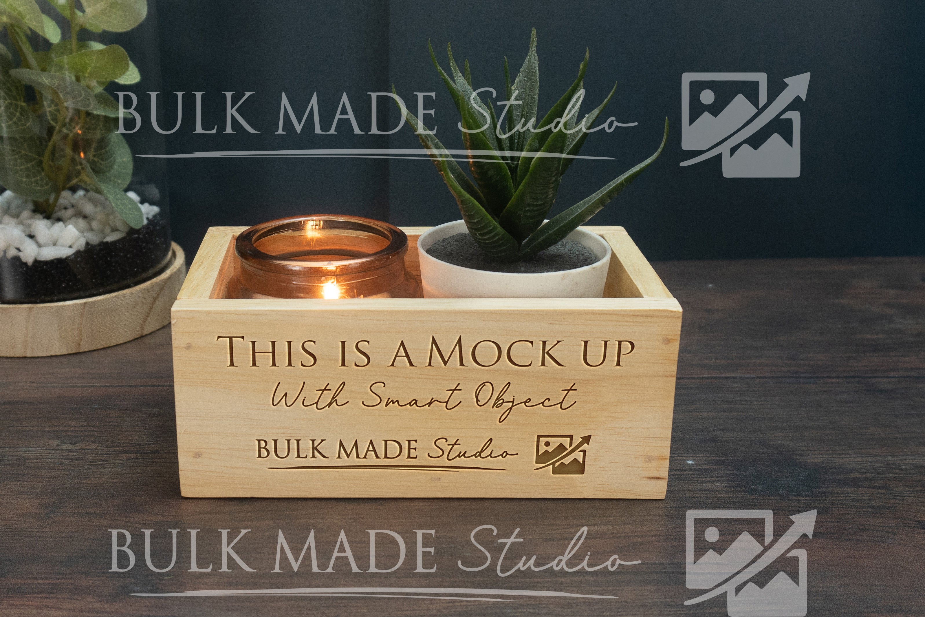 Wooden box with a candle holder and small plant, branded 'Bulk Made Studio'.