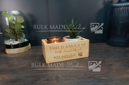 Wooden box with plants and a pot on a wooden surface, branded 'Bulk Made Studio'.